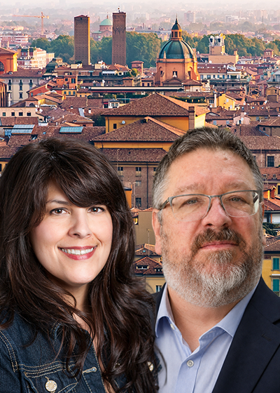 Eugene Giest and Cyndi DiCarlo in front of an Italian scene
