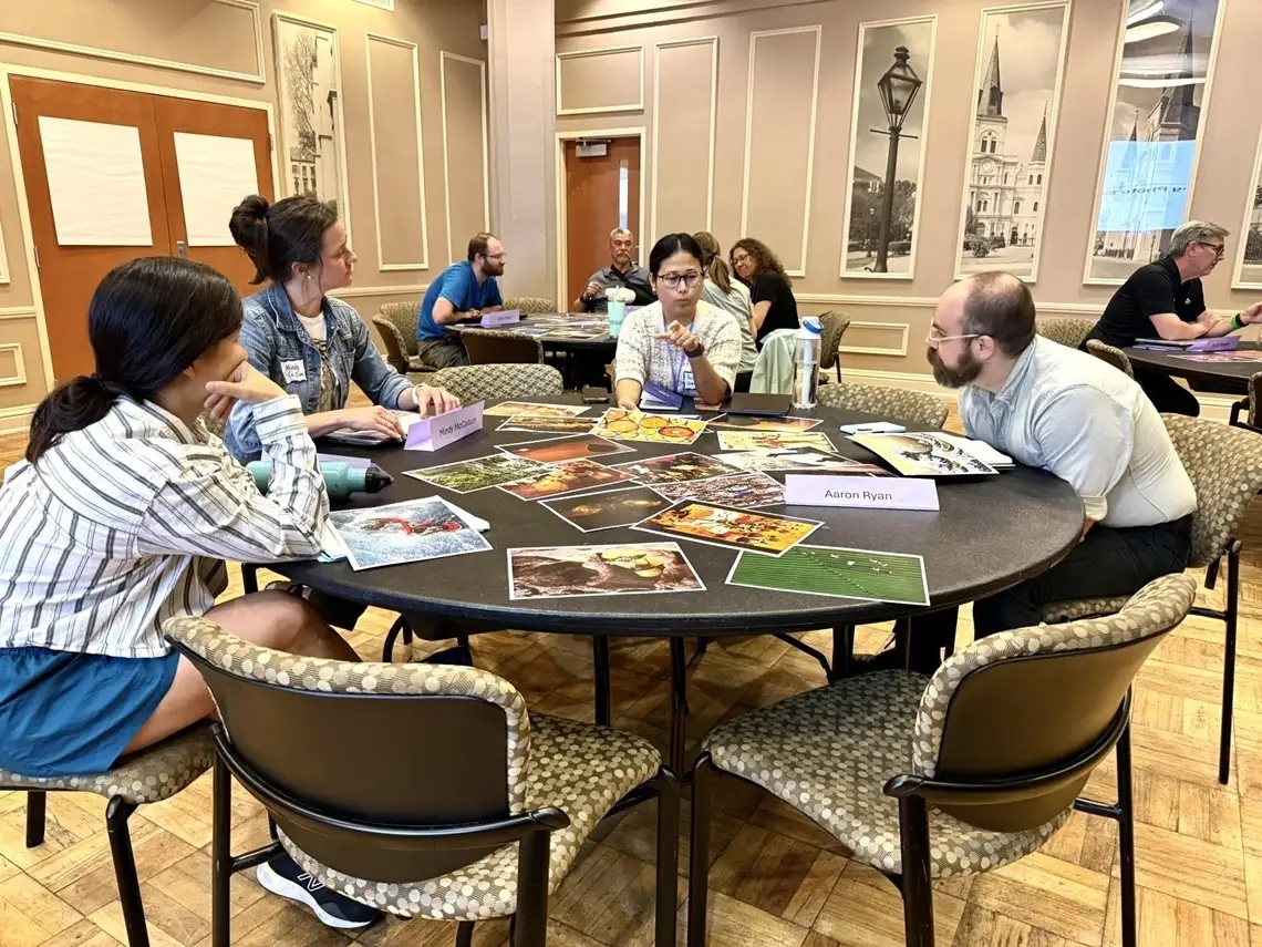 people sitting around a table talking